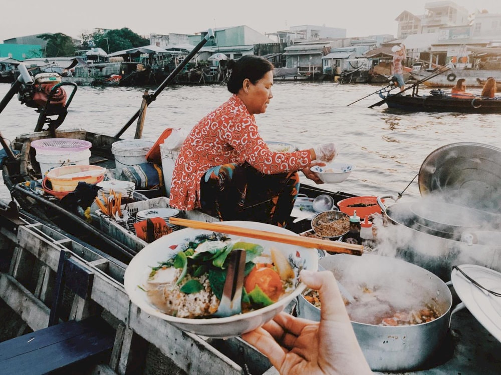 a steaming hot bowl of bun rieuon the boat